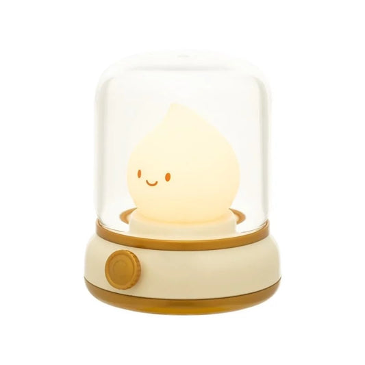 Close-up of cream LED night light base with amber button and dome