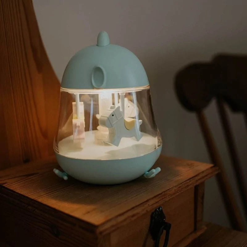 Illuminated blue night light casting soft glow on wooden surface