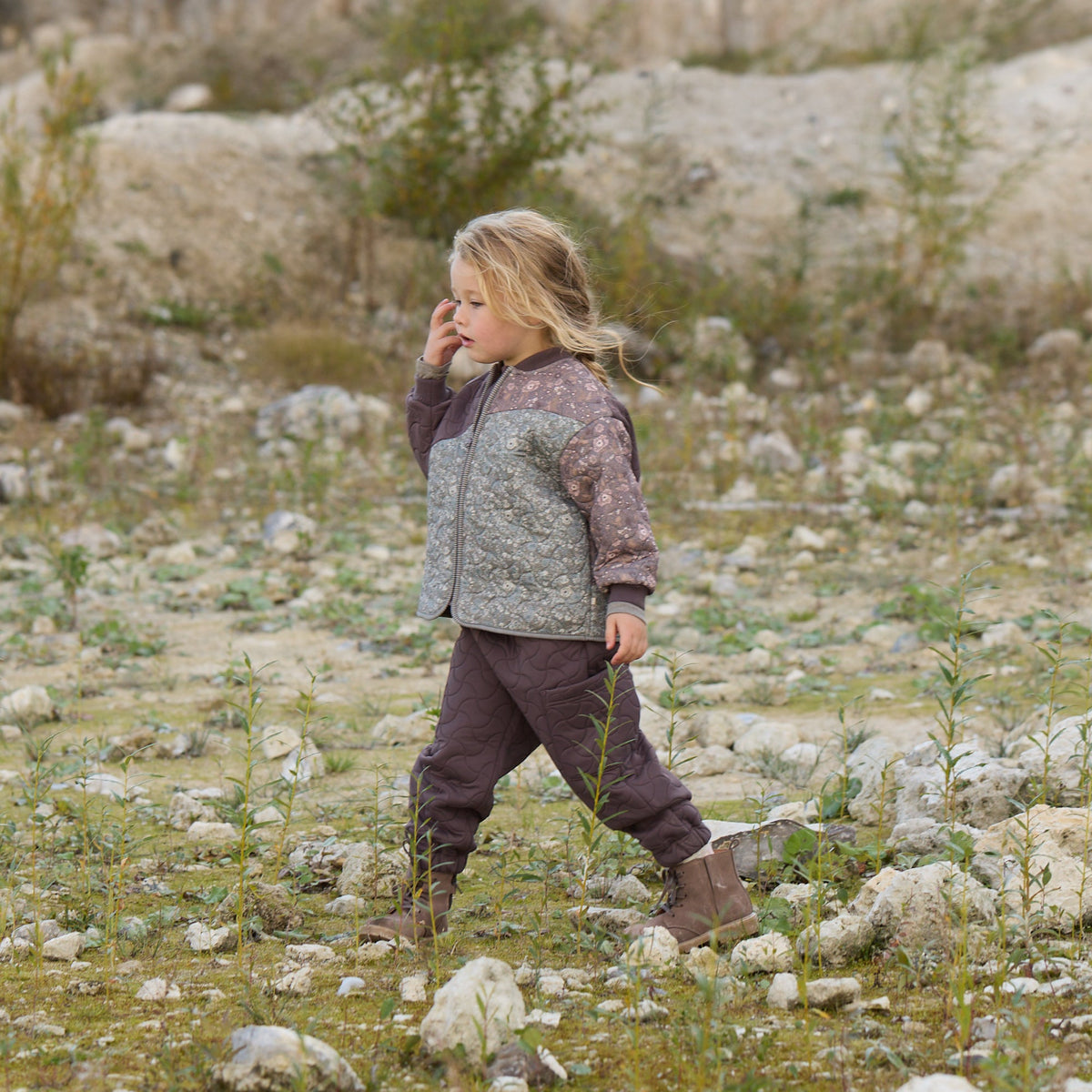 Toddler walking in Nanna thermal jacket and matching trousers set