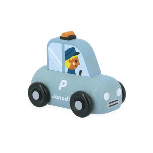 Close-up of Janod light blue wooden police car with officer figure